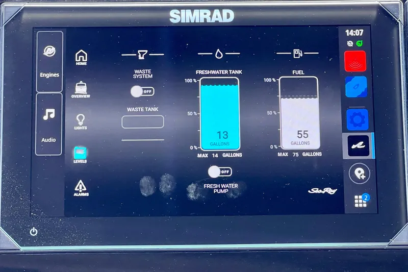 Slide: The Image of Simrad display on 2024 Sea Ray SLX 260 Outboard showing fuel and freshwater levels. - 45