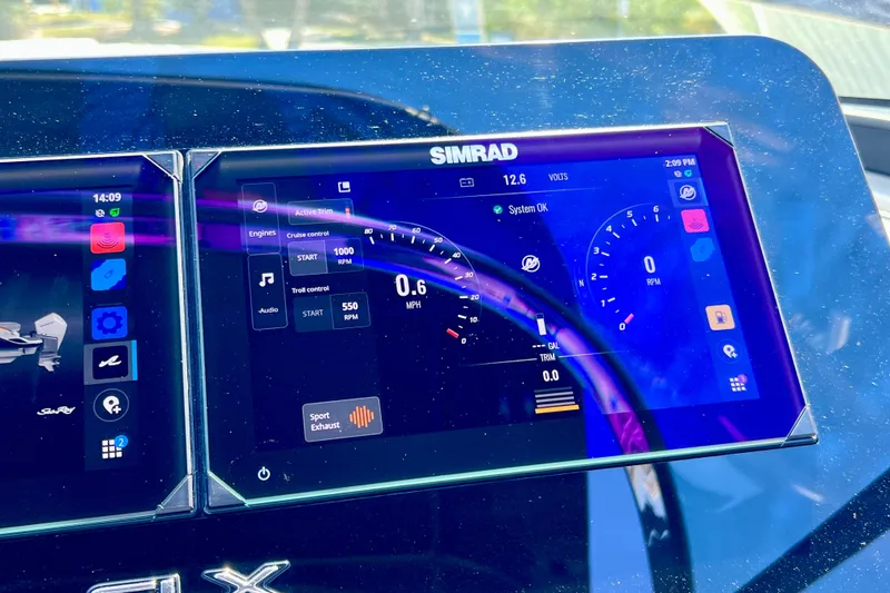 Slide: The Image of Simrad display on 2024 Sea Ray SLX 260 Outboard showing engine and navigation data. - 49