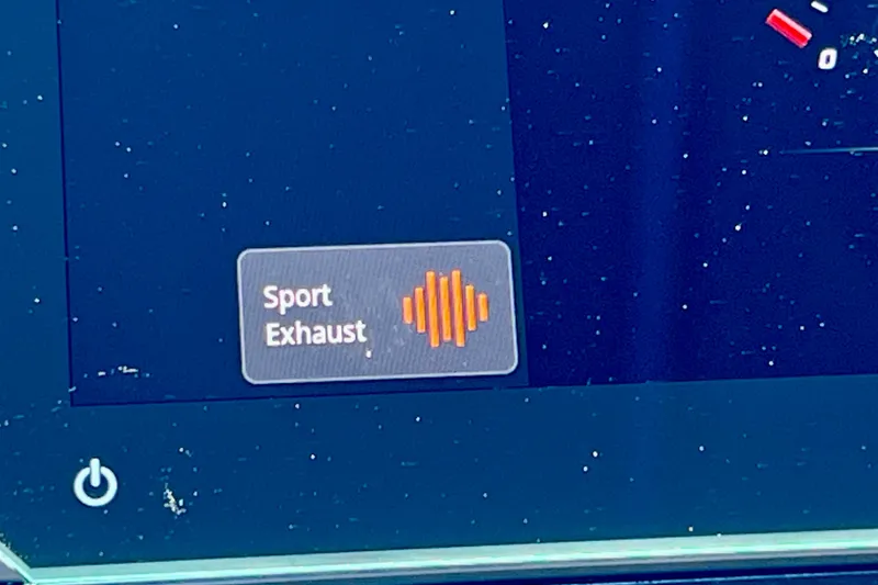 Slide: The Image of "Sport Exhaust" button on 2024 Sea Ray SLX 260 Outboard display screen. - 50