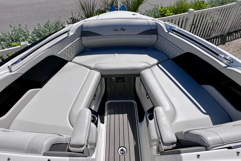 Slide: The Image of 2024 Sea Ray SLX 260 Outboard boat interior with luxurious seating and sleek design. - 51