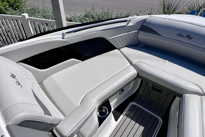 Slide: The Image of Luxurious interior of 2024 Sea Ray SLX 260 Outboard boat with elegant seating. - 52