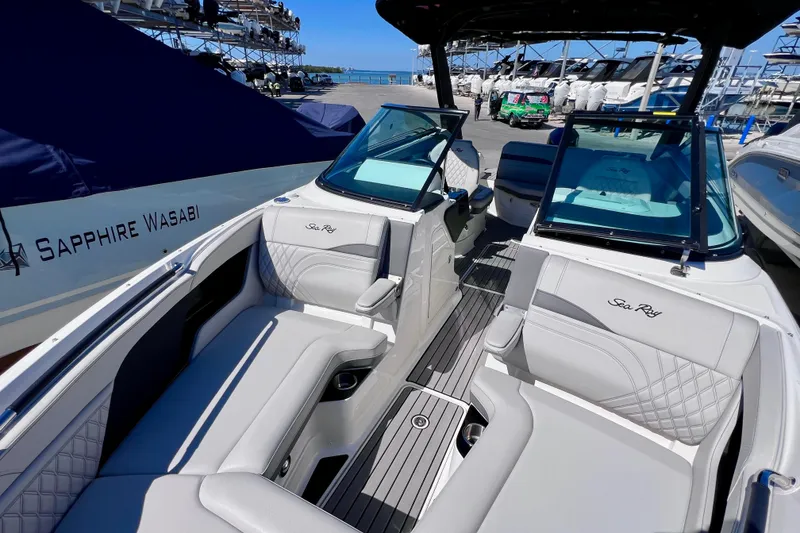 Slide: The Image of 2024 Sea Ray SLX 260 Outboard boat interior with luxurious seating and sleek design. - 55