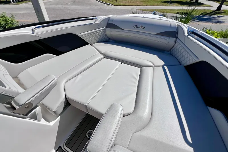 Slide: The Image of 2024 Sea Ray SLX 260 Outboard boat interior with luxurious seating and modern design. - 61