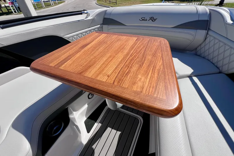 Slide: The Image of Luxurious interior of 2024 Sea Ray SLX 260 Outboard with elegant wooden table. - 65