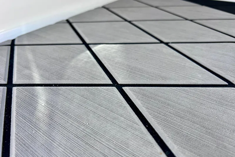 Slide: The Image of Close-up of textured flooring on 2024 Sea Ray SLX 260 Outboard boat. - 68