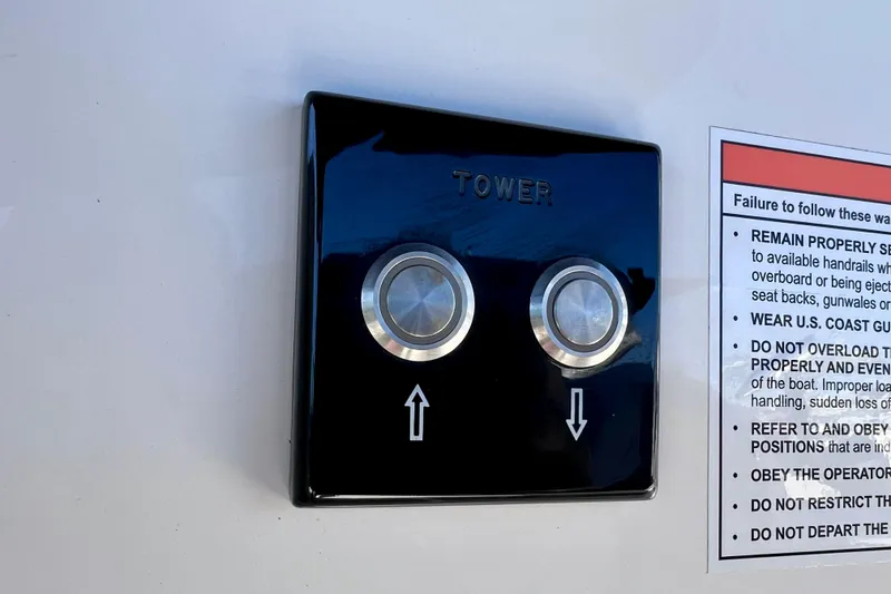 Slide: The Image of Control panel on 2024 Sea Ray SLX 260 Outboard boat with safety instructions. - 71