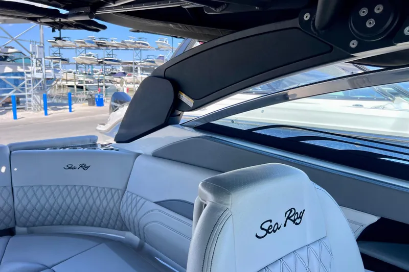 Slide: The Image of 2024 Sea Ray SLX 260 Outboard interior with luxurious seating and sleek design. - 74