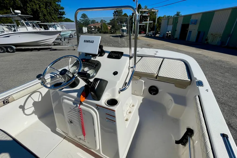 Slide: The Image of 2021 Carolina Skiff 17 LS boat interior with steering console and Simrad display. - 12