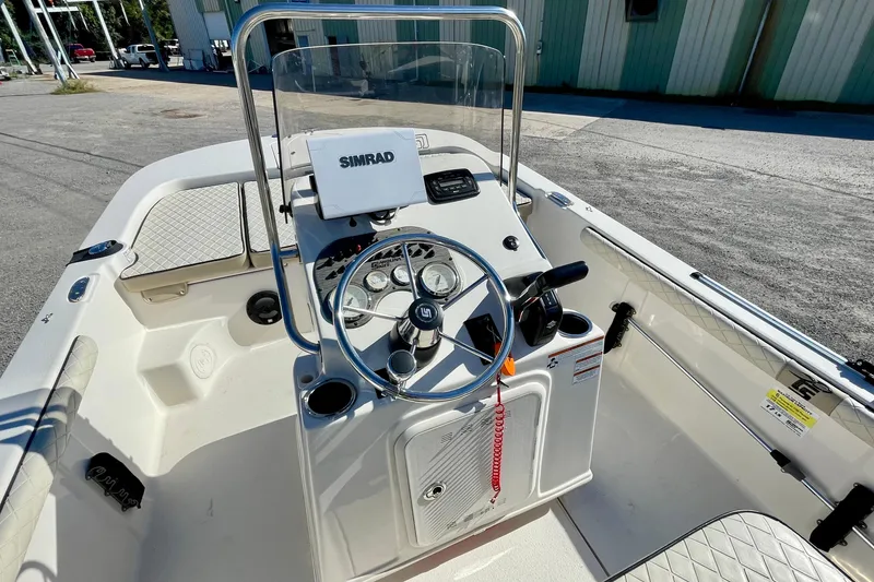 Slide: The Image of 2021 Carolina Skiff 17 LS boat interior with steering console and Simrad display. - 13