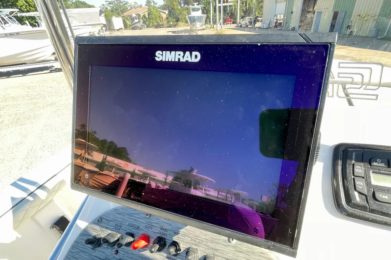 Slide: The Image of Simrad display on 2021 Carolina Skiff 17 LS boat dashboard. - 18