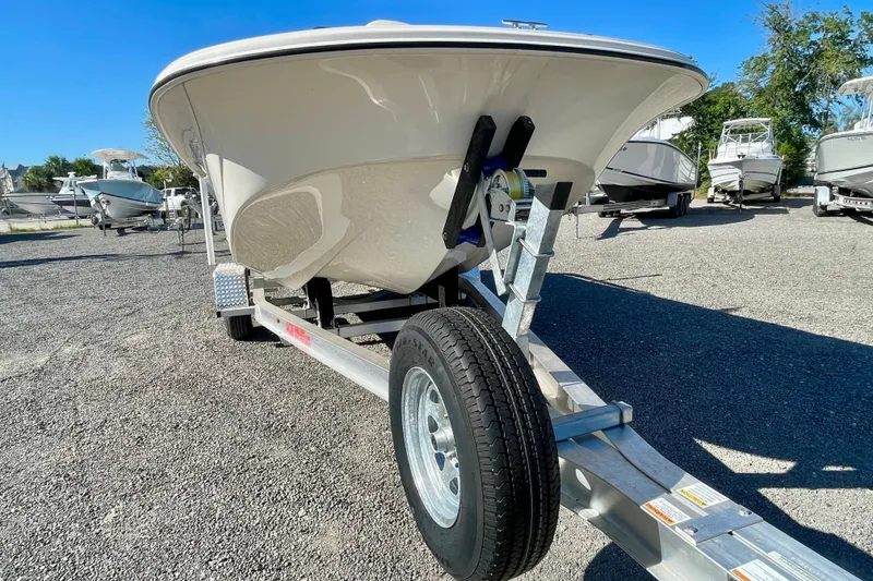 Slide: The Image of 2021 Carolina Skiff 17 LS boat on trailer in sunny outdoor setting. - 6