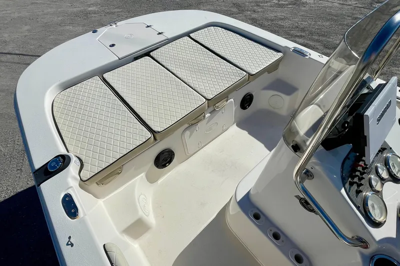 Slide: The Image of 2021 Carolina Skiff 17 LS boat interior with cushioned seating and control panel. - 8
