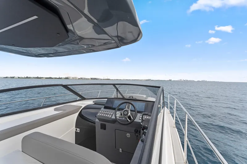 Slide: The Image of 2025 Valiatt 380GT yacht cockpit with ocean view and modern controls. - 18