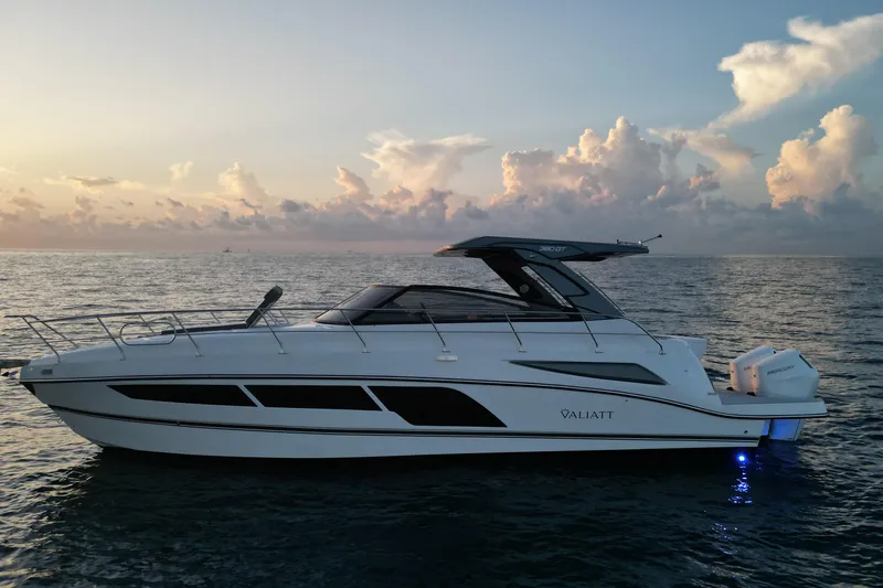 Slide: The Image of 2025 Valiatt 380GT luxury yacht cruising at sunset on open water. - 2