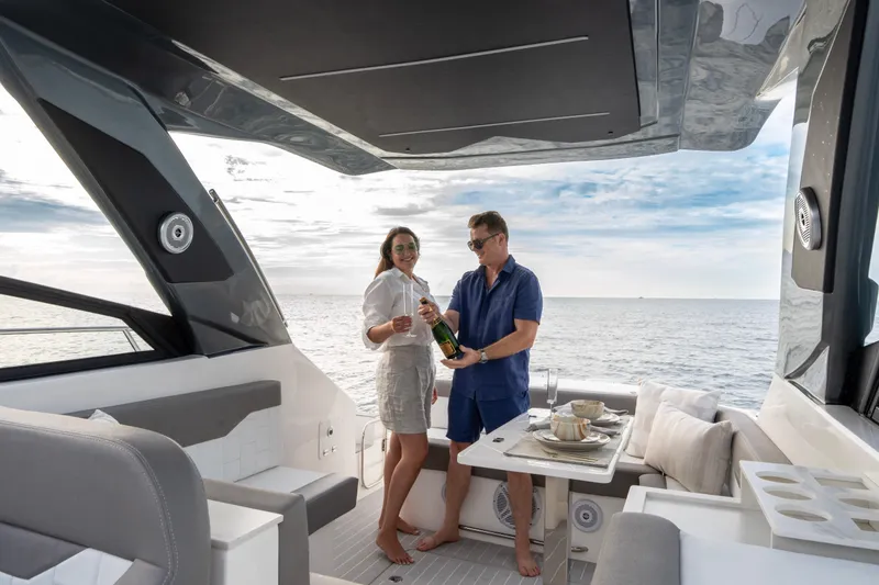 Slide: The Image of Couple enjoying champagne on a 2025 Valiatt 380GT yacht, with ocean view. - 23