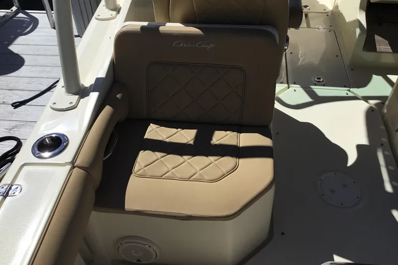 Slide: The Image of 2016 Chris-Craft Calypso 26 boat seat with tan upholstery and diamond stitching. - 15