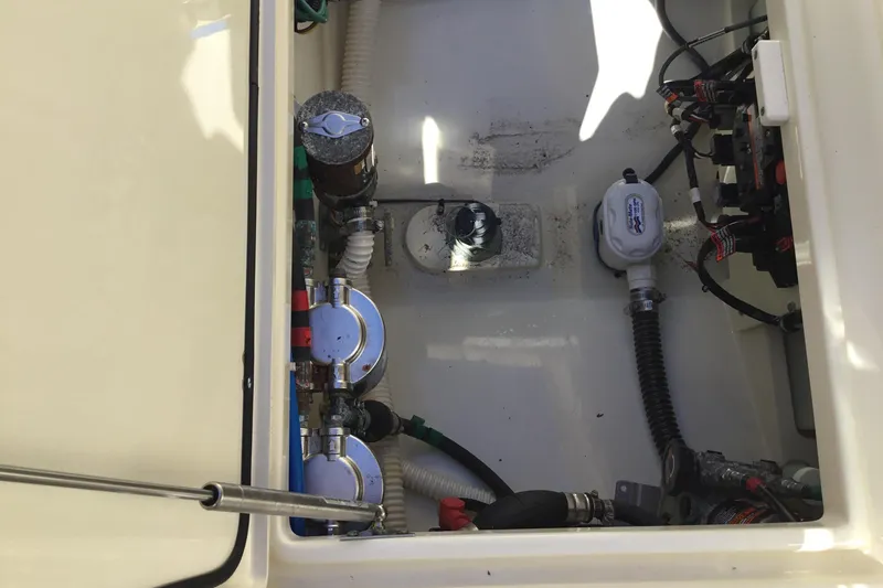 Slide: The Image of Engine compartment of a 2016 Chris-Craft Calypso 26 boat, showing mechanical components. - 21