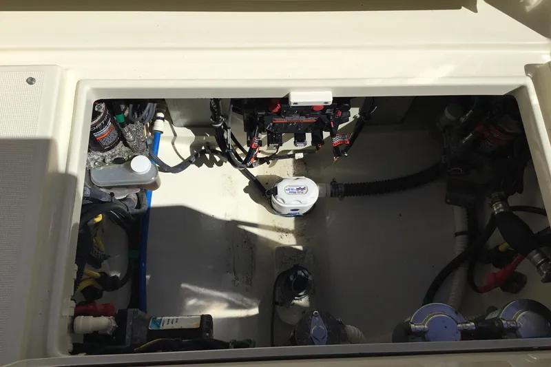 Slide: The Image of Engine compartment of 2016 Chris-Craft Calypso 26 boat, showcasing wiring and components. - 22