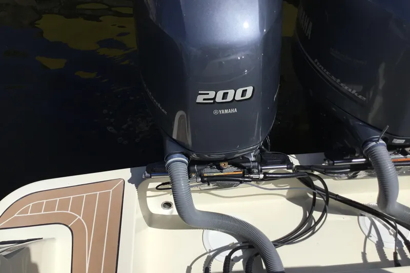Slide: The Image of Twin Yamaha 200 engines on a 2016 Chris-Craft Calypso 26 boat. - 29