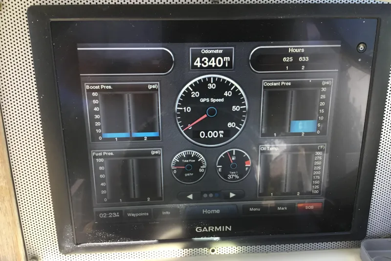 Slide: The Image of Garmin display on 2016 Chris-Craft Calypso 26 showing odometer and engine metrics. - 3