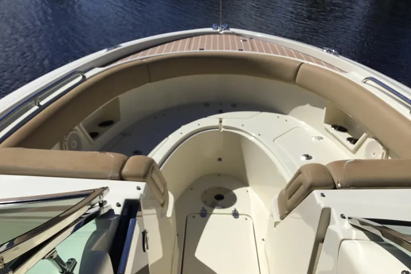 Slide: The Image of 2016 Chris-Craft Calypso 26 boat interior with tan seating and sleek design. - 36