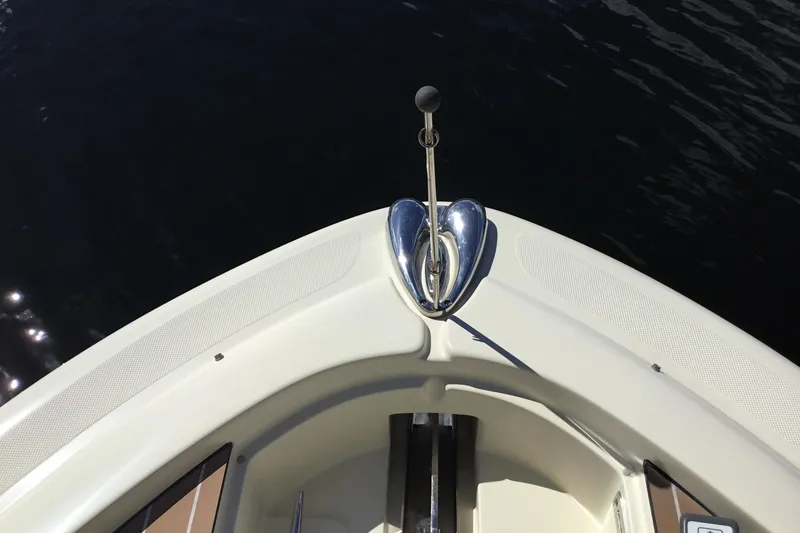 Slide: The Image of Bow of 2016 Chris-Craft Calypso 26 boat with anchor, on dark water. - 41