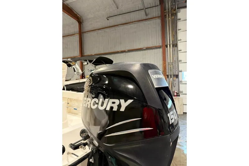 Slide: The Image of 2008 Boston Whaler 190 Outrage boat, side view with logo and anniversary marking. - 12