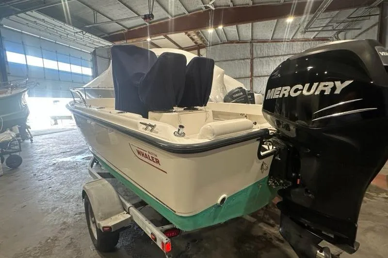 Slide: The Image of 2008 Boston Whaler 190 Outrage boat with Mercury engine in storage facility. - 20