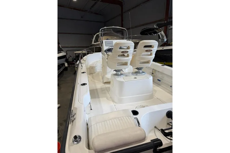 Slide: The Image of 2008 Boston Whaler 190 Outrage boat console with steering wheel and navigation equipment. - 5