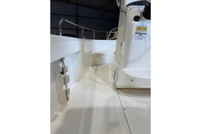 Slide: The Image of 2008 Boston Whaler 190 Outrage boat seats at a marina dock. - 7