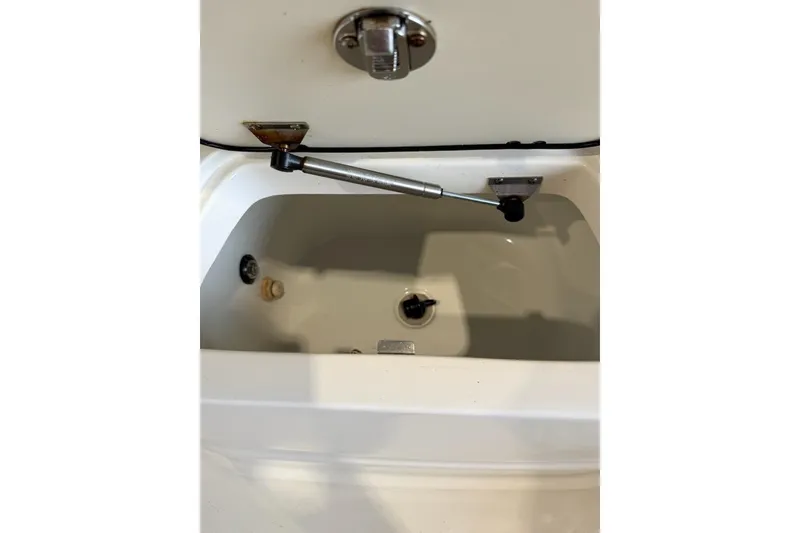 Slide: The Image of 2008 Boston Whaler 190 Outrage boat interior with dual seats in a storage facility. - 8