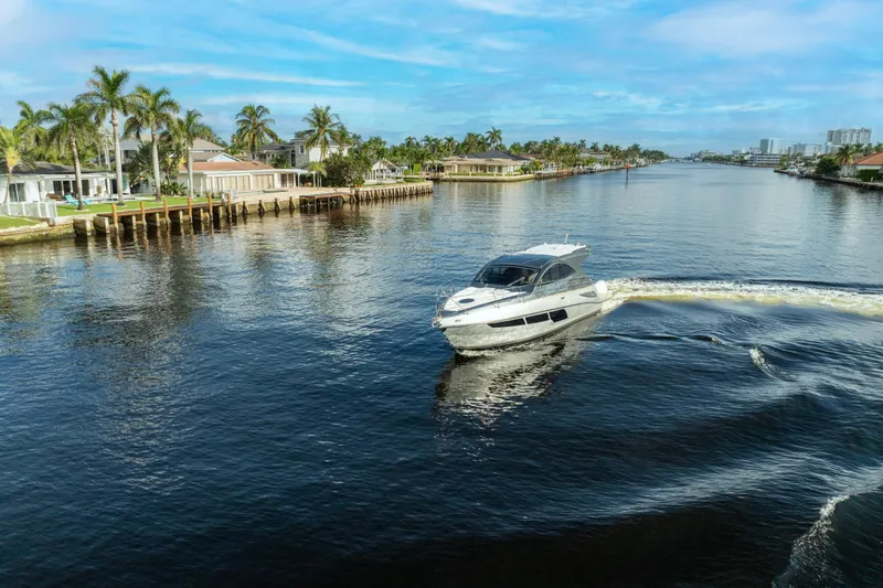 Slide: The Image of Luxury Valiatt 410HT yacht cruising on a scenic waterway, 2025 model. - 13