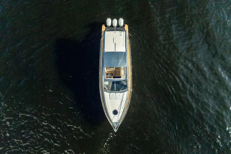 Slide: The Image of Top view of 2025 Valiatt 410HT yacht cruising on dark water. - 27