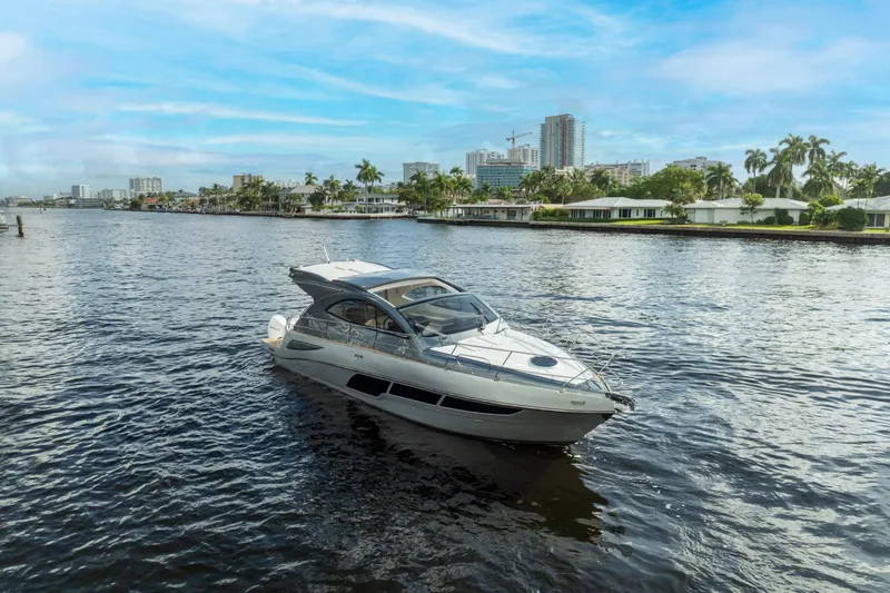 Slide: The Image of Luxury Valiatt 410HT yacht cruising on a scenic waterway, 2025 model. - 28