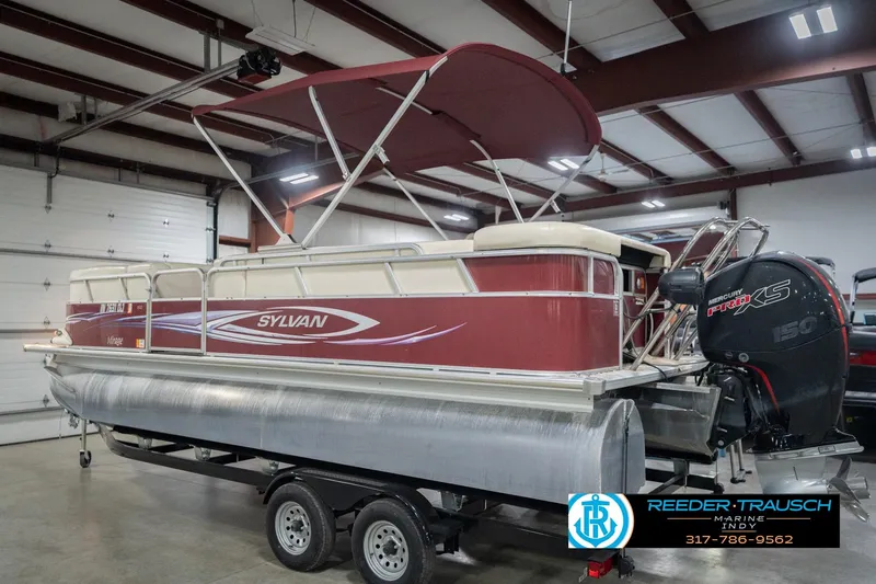 Slide: The Image of 2010 Sylvan 8522 Mirage Cruise pontoon boat in indoor storage. - 10