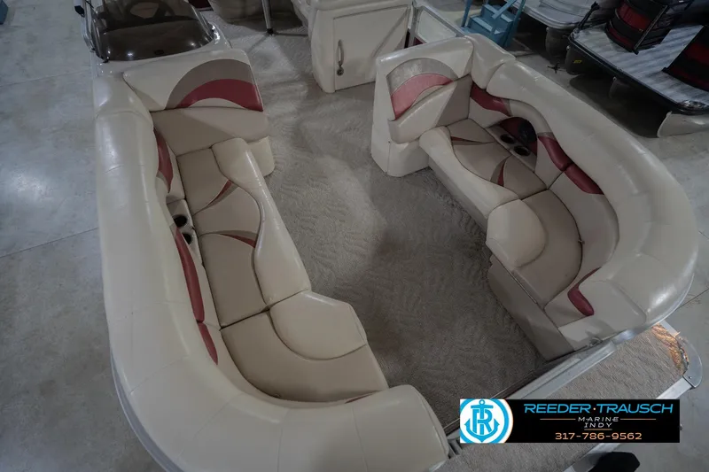 Slide: The Image of 2010 Sylvan 8522 Mirage Cruise boat interior with beige and red seating. - 13