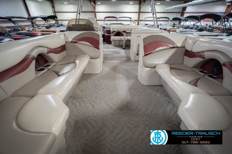 Slide: The Image of Interior of a 2010 Sylvan 8522 Mirage Cruise pontoon boat with beige seating. - 16