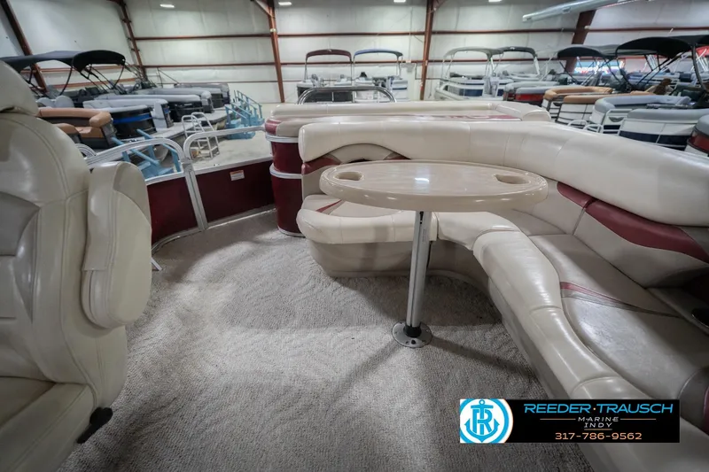 Slide: The Image of Interior of 2010 Sylvan 8522 Mirage Cruise pontoon boat with seating and table. - 18