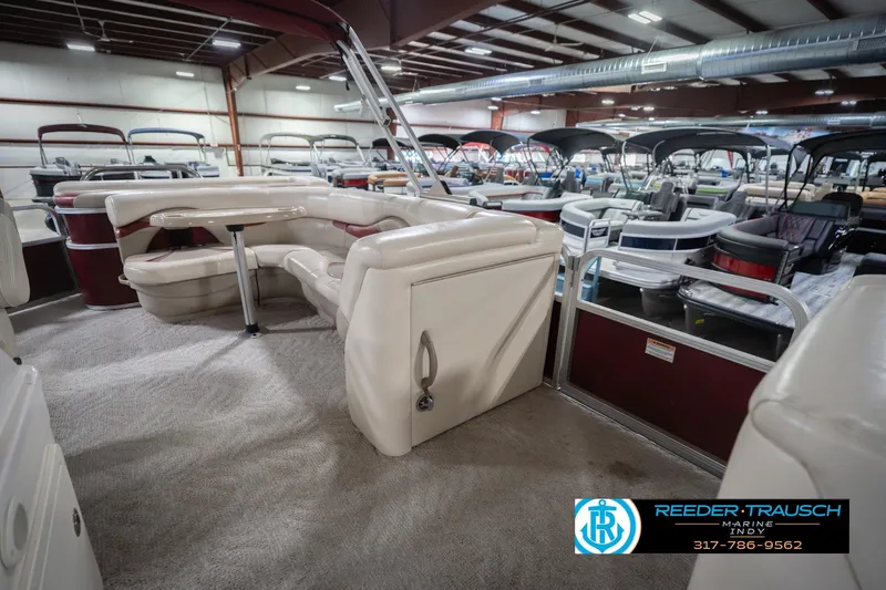 Slide: The Image of 2010 Sylvan 8522 Mirage Cruise pontoon boat interior in showroom setting. - 25