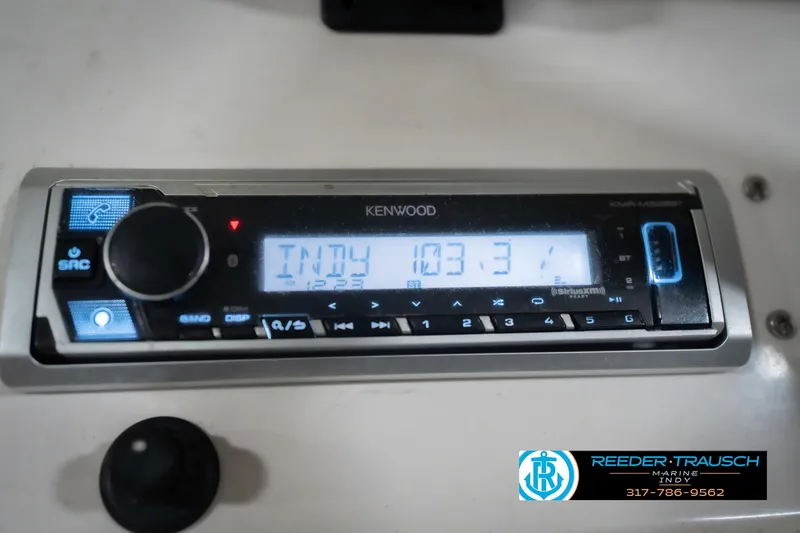 Slide: The Image of Kenwood stereo system in 2010 Sylvan 8522 Mirage Cruise boat, tuned to 103.3 FM. - 34