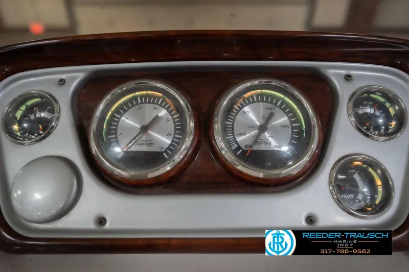 Slide: The Image of Dashboard of a 2010 Sylvan 8522 Mirage Cruise boat with gauges and controls. - 36