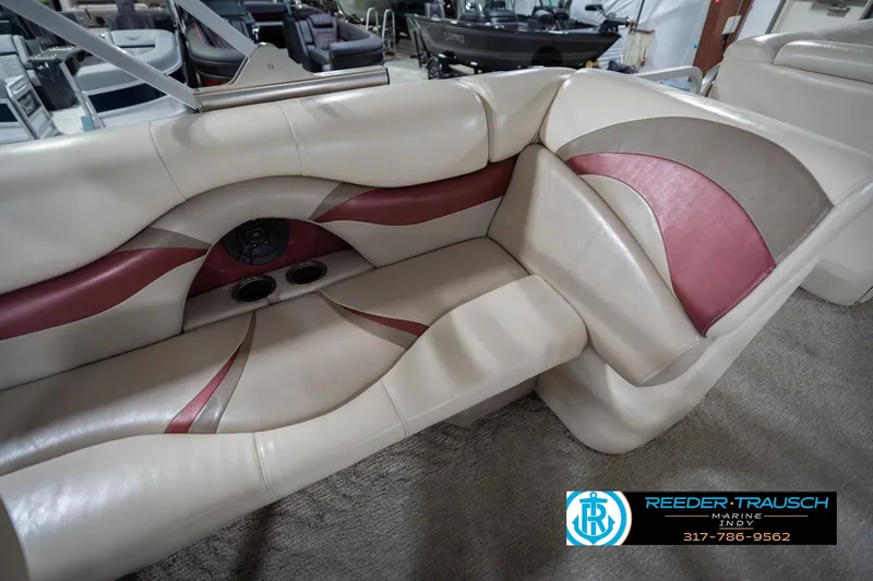 Slide: The Image of 2010 Sylvan 8522 Mirage Cruise boat interior with beige and red seating. - 40