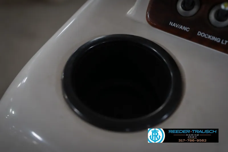 Slide: The Image of Cup holder on 2010 Sylvan 8522 Mirage Cruise boat dashboard with control panel. - 45