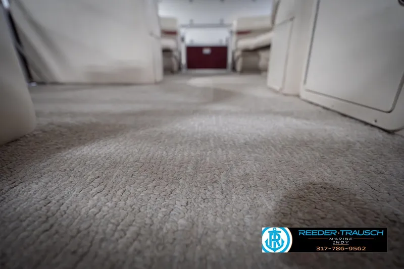 Slide: The Image of Interior view of 2010 Sylvan 8522 Mirage Cruise boat with carpet flooring. - 46