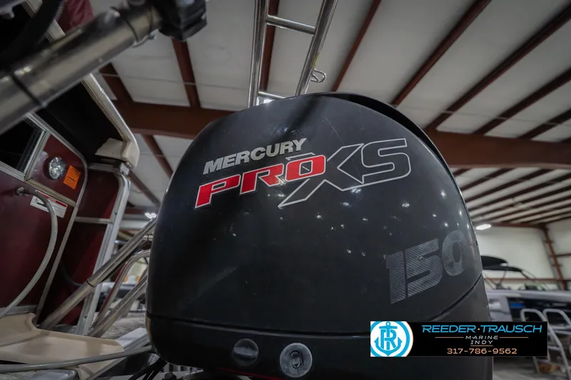 Slide: The Image of Mercury Pro XS 150 engine on 2010 Sylvan 8522 Mirage Cruise boat in warehouse. - 48