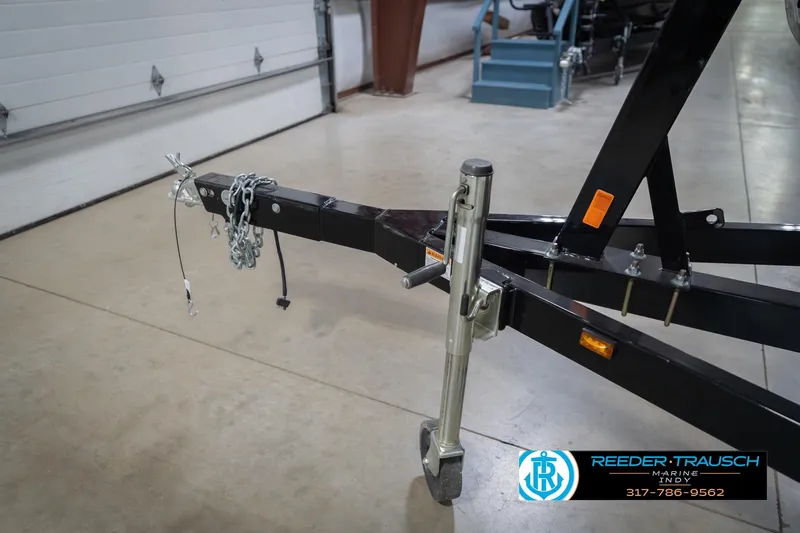 Slide: The Image of Trailer hitch and jack stand in a garage, Sylvan 8522 Mirage Cruise 2010. - 55