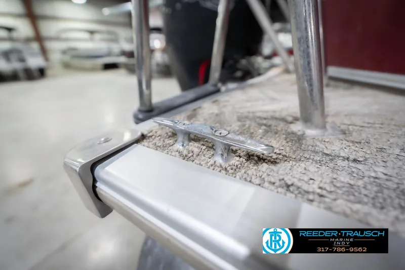 Slide: The Image of Close-up of 2010 Sylvan 8522 Mirage Cruise boat cleat in a showroom. - 57