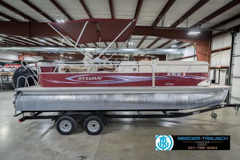 Slide: The Image of 2010 Sylvan 8522 Mirage Cruise pontoon boat in indoor showroom. - 7