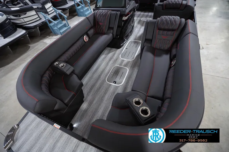 Slide: The Image of Luxurious interior of 2026 Bennington 25 RSB pontoon boat with plush seating and cup holders. - 12