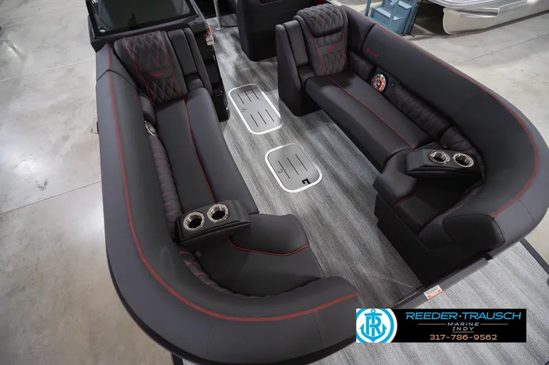 Slide: The Image of Luxurious interior of 2026 Bennington 25 RSB pontoon boat with plush seating and cup holders. - 13